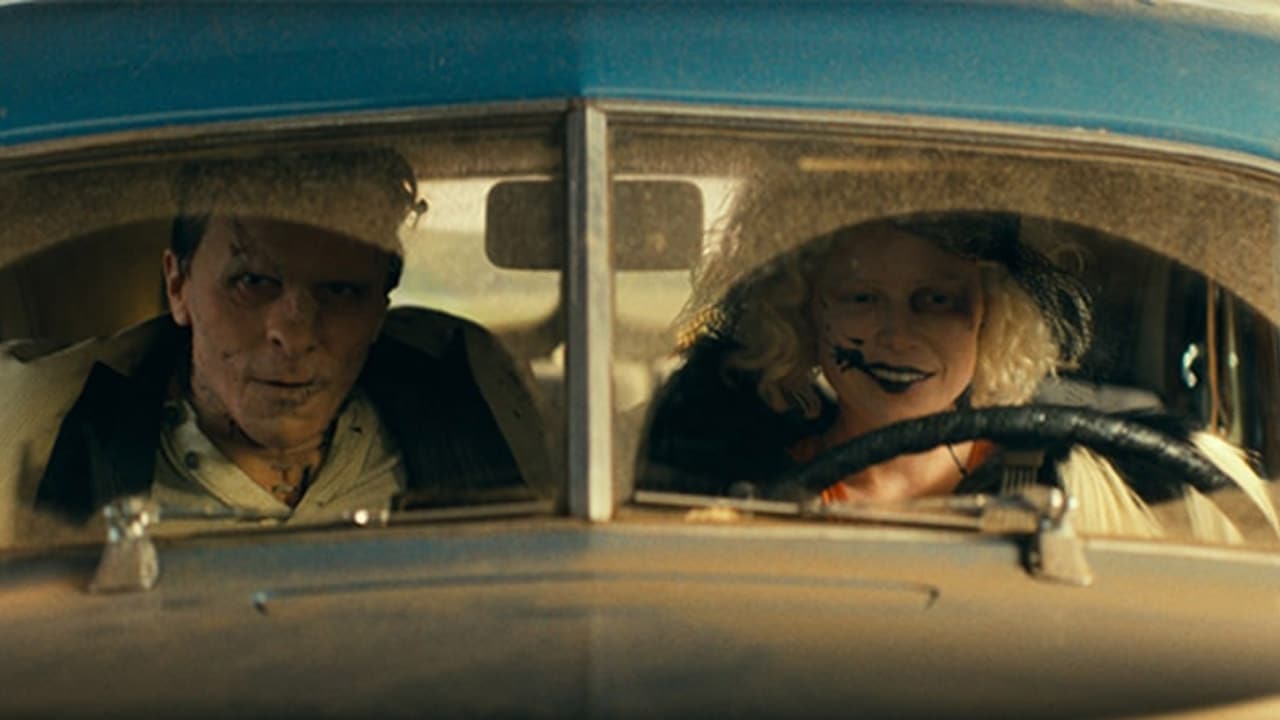 The Bride and her (and Frankenstein's) monster on the run in a classic 1930s car