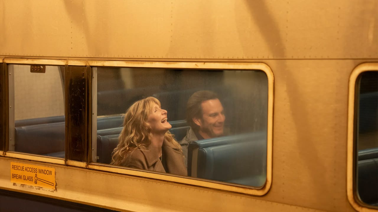 Will Arnett and Laura Dern sit on a New York train in Is This Thing On